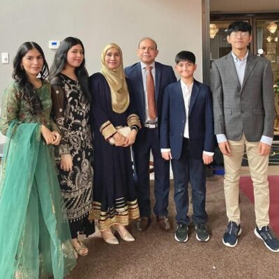 A group of people standing in a row facing the camera.